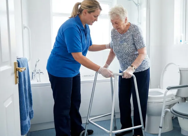 Carer assisting with daily living support
